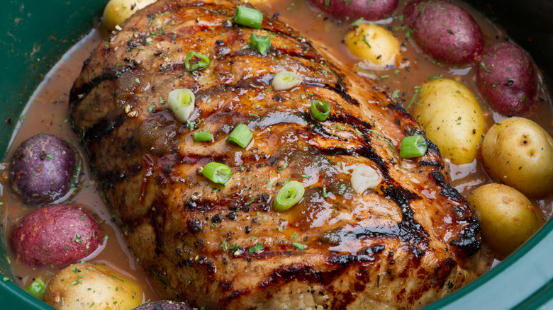 A pot roast swimming with potatoes