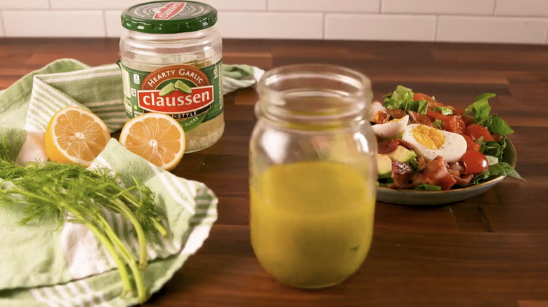 Ingredients with pickle vinaigrette in jar