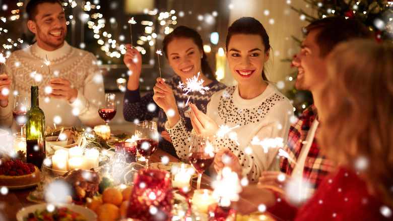 People gathered around a holiday table