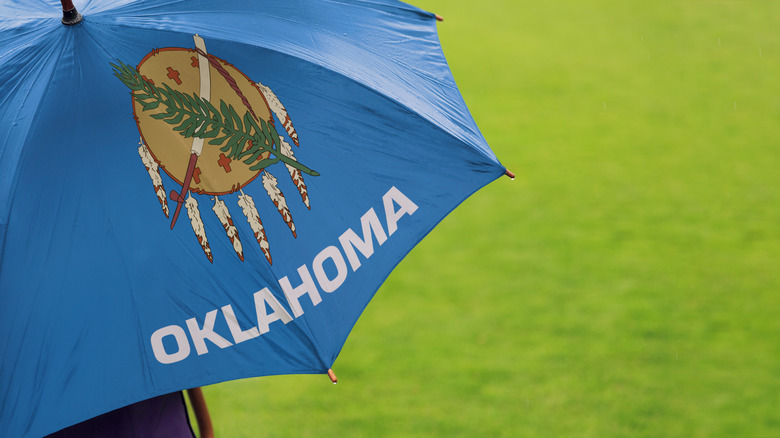 A big umbrella emblazoned with "Oklahoma" 