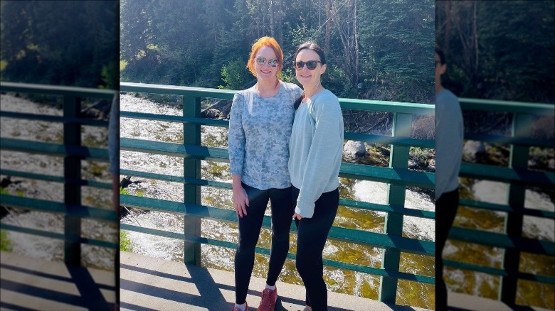 Ree Drummond and friend posing on bridge