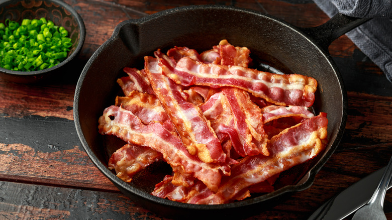 Fried bacon in a skillet