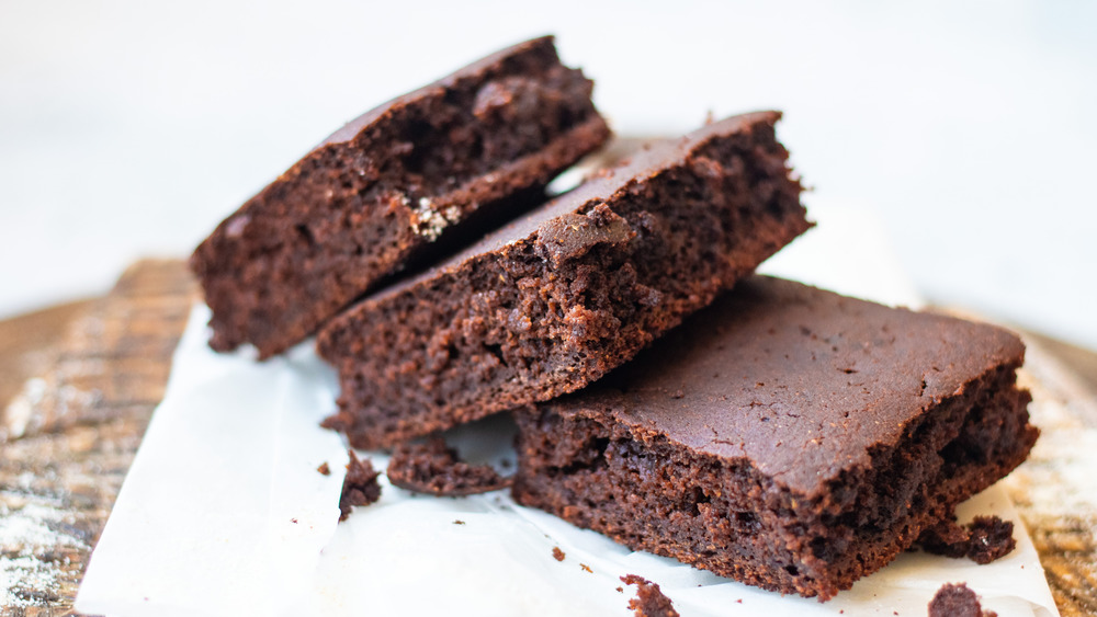 Three brownies on a napkin