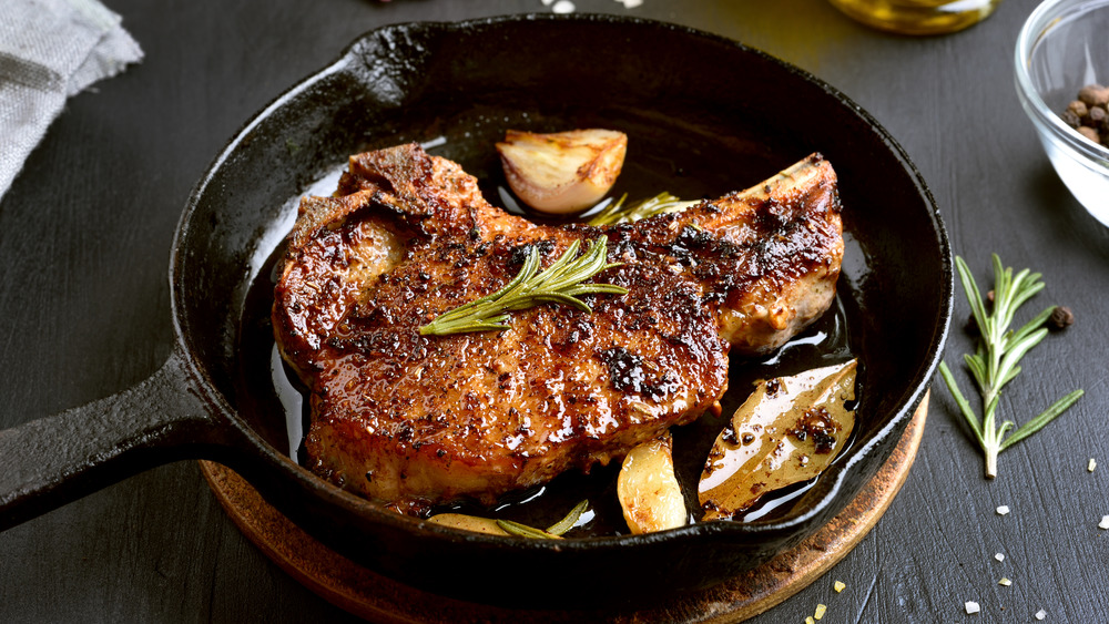 Fried pork chop in skillet