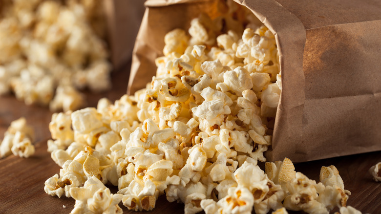 Popcorn pouring out of a bag