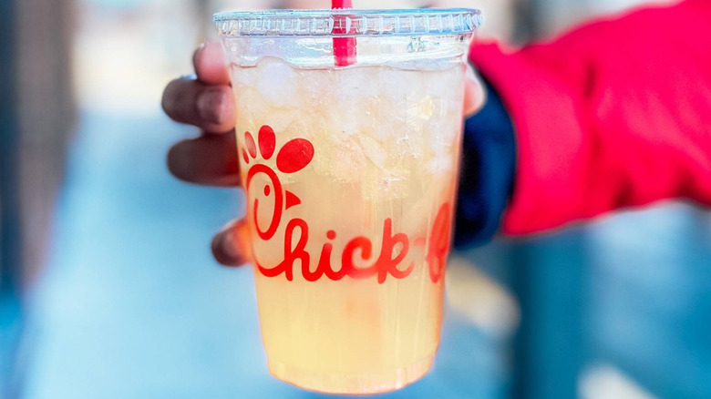 Hand holding Chick-fil-A lemonade