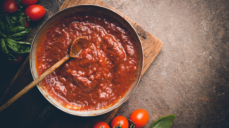 Tomato sauce on a brown wood board