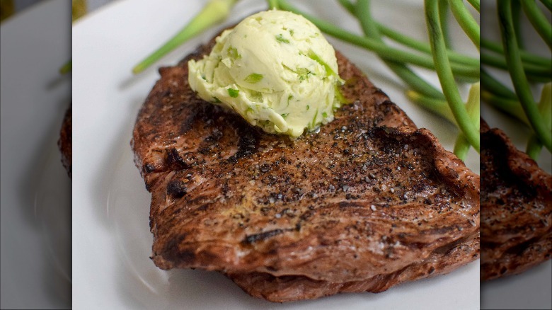 Compound butter on plated steak