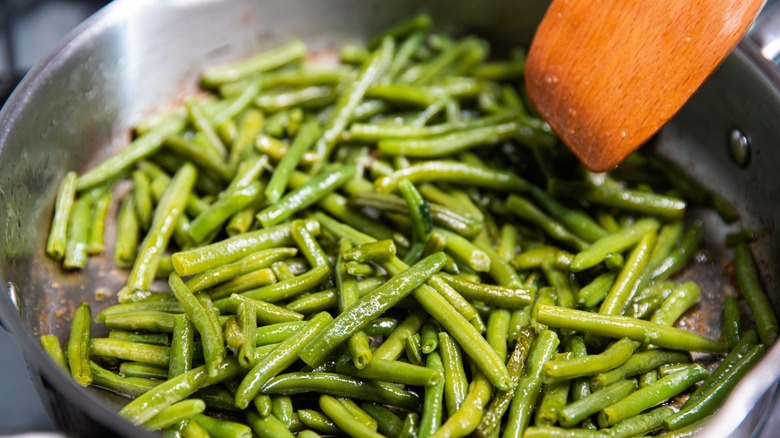 green beans sauteing in pan