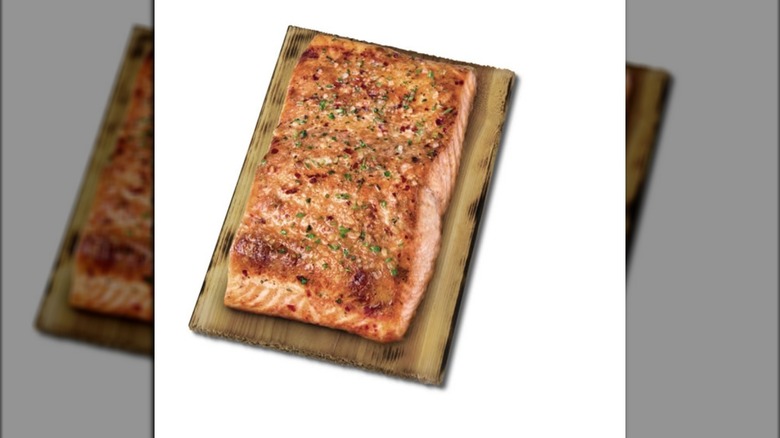 Cedar salmon steak on wood