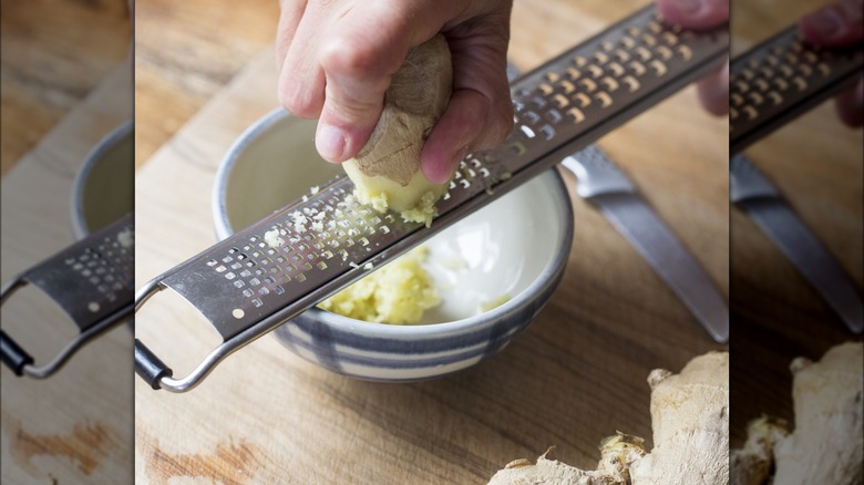 hand grating ginger with microplane