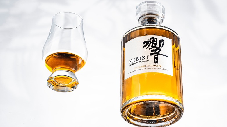 Suntory whisky bottle and glass