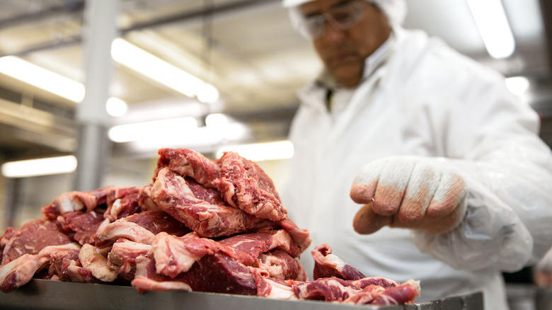 Worker at a meat packing plant