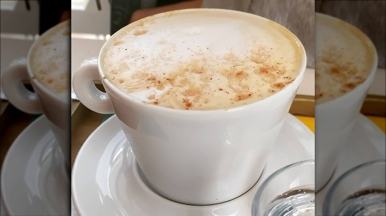 Foamy cappuccino in white cup