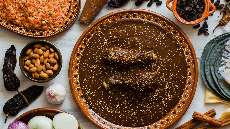 Mole surrounded by side dishes