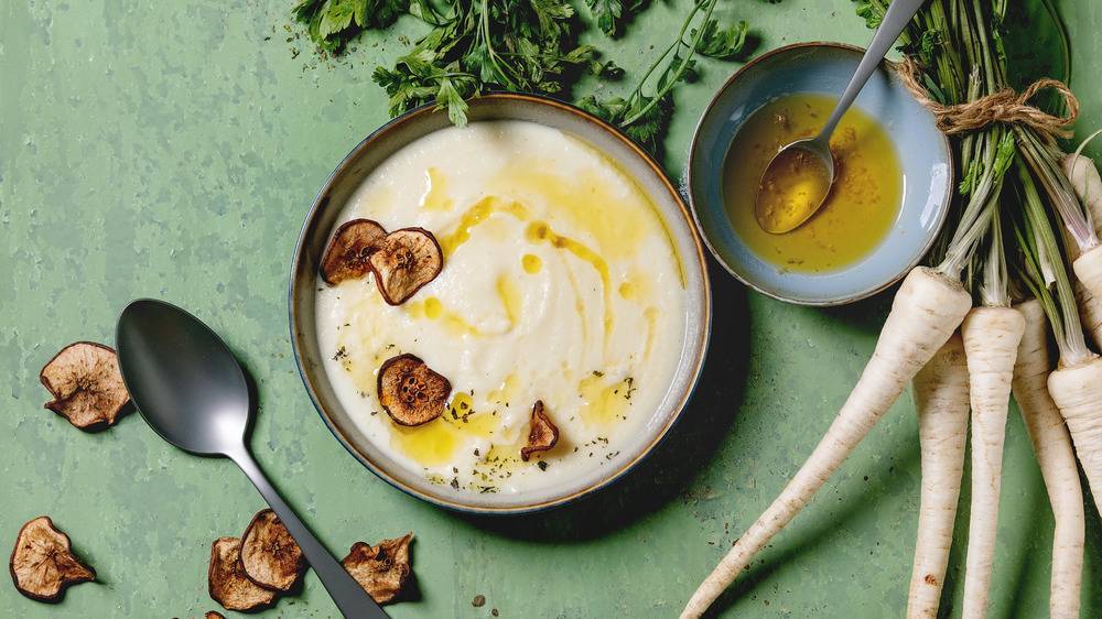 Parsnip cream soup with pear chips and butter