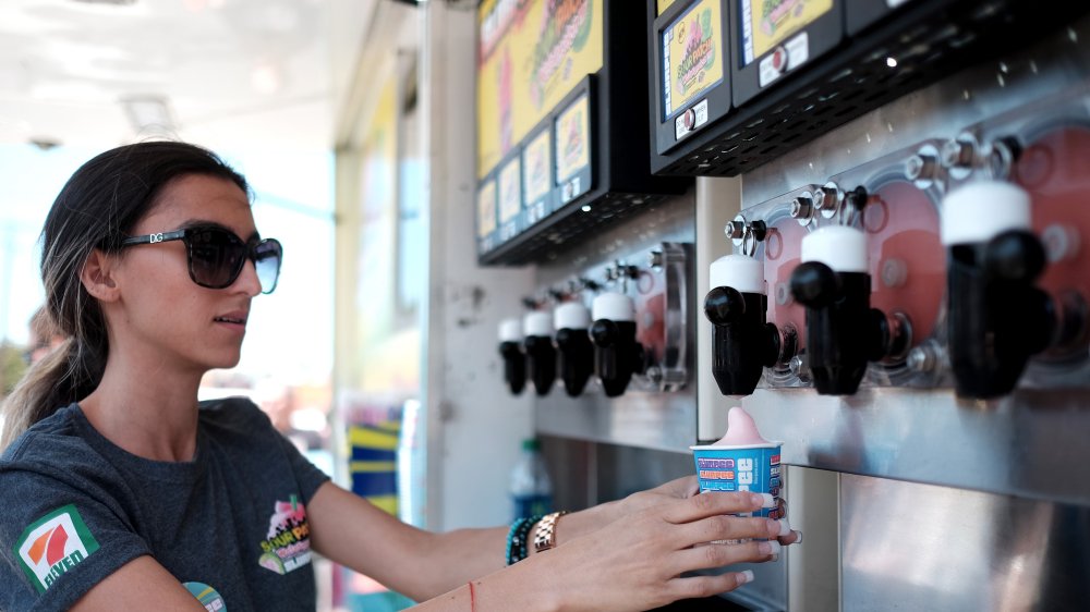 7-Eleven employee pouring Slurpees