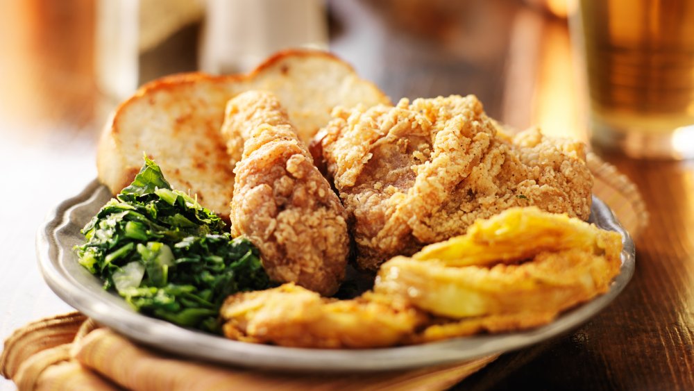 plate of southern food with fried chicken and collard greens