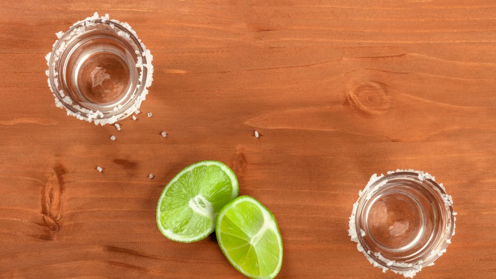 Salt-rimmed glasses and lime