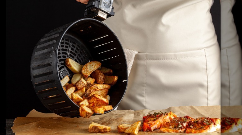 Person emptying an air fryer