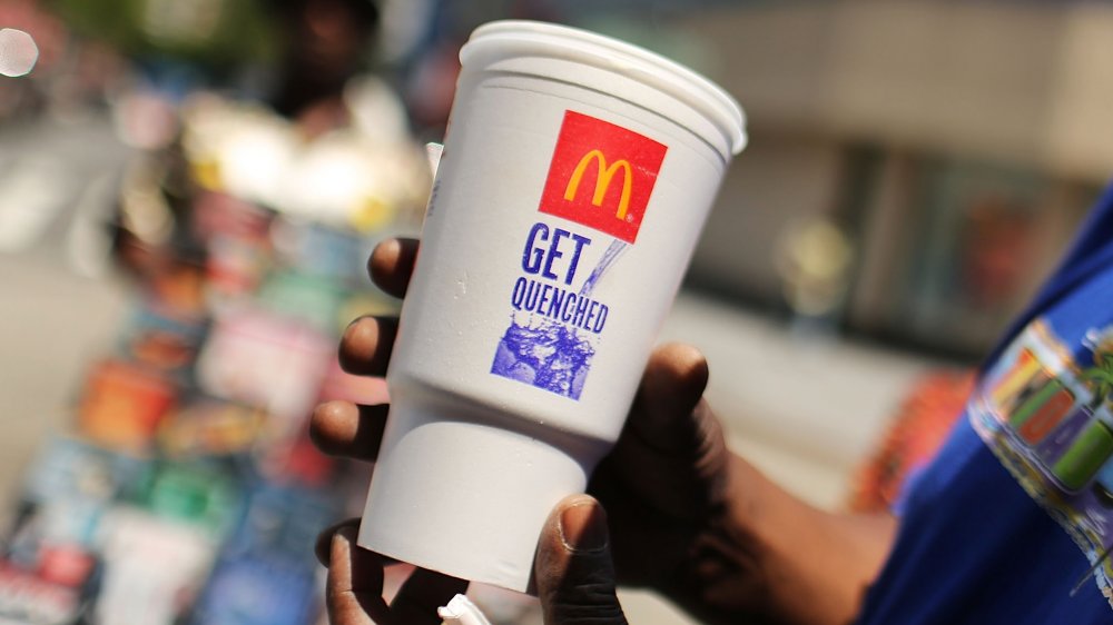 Man holding McDonald's drink