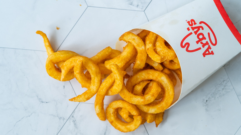 Arby's curly fries spilling