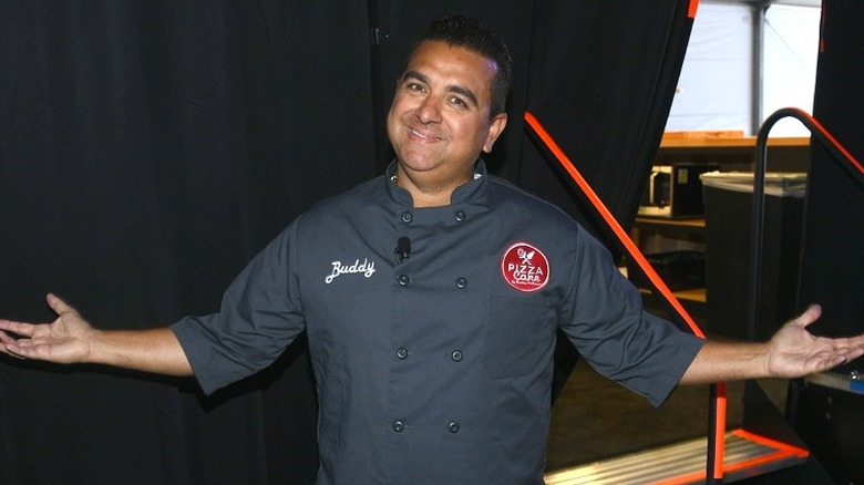 Buddy Valastro smiling with arms open