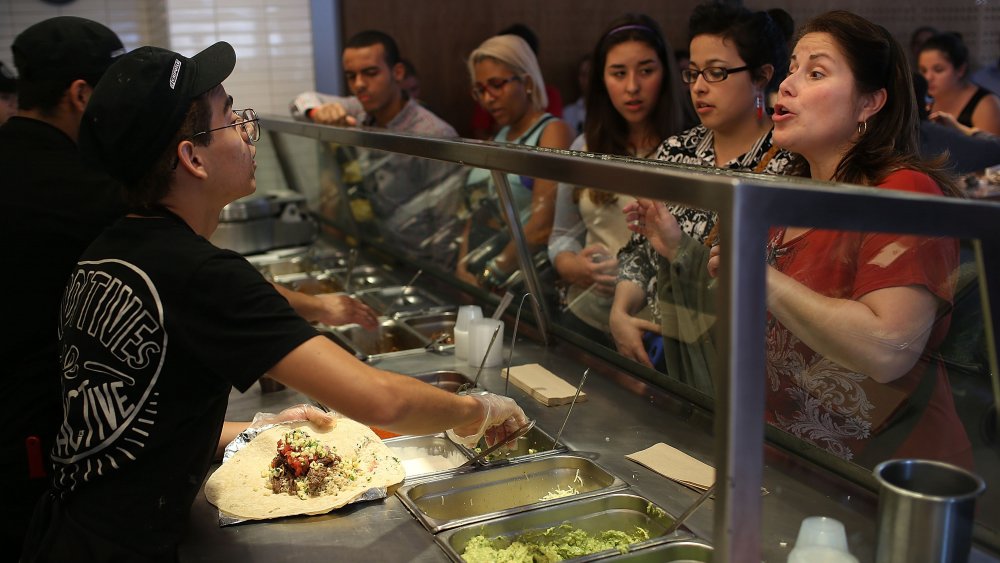 Chipotle workers and customers