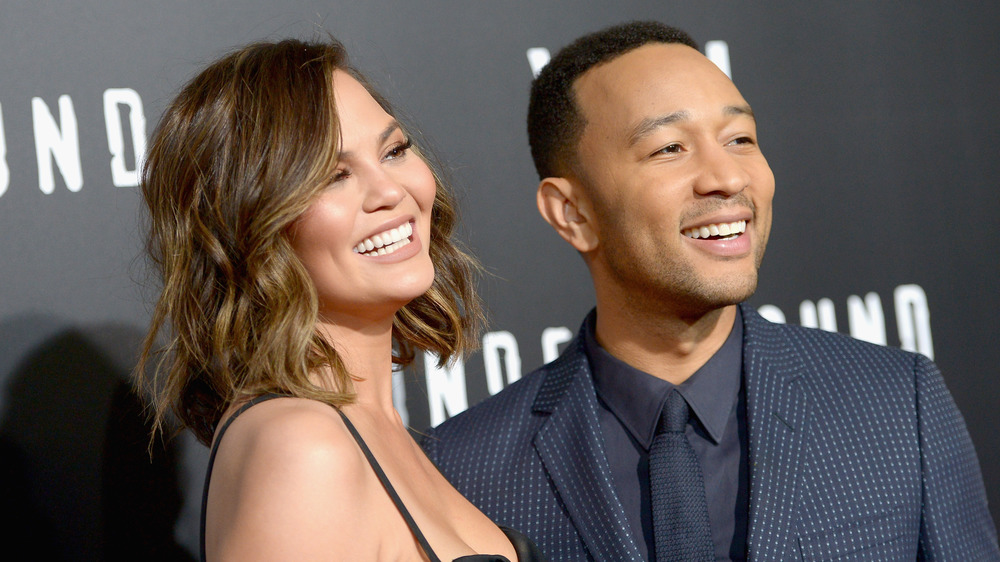 Chrissy Teigen and John Legend laugh