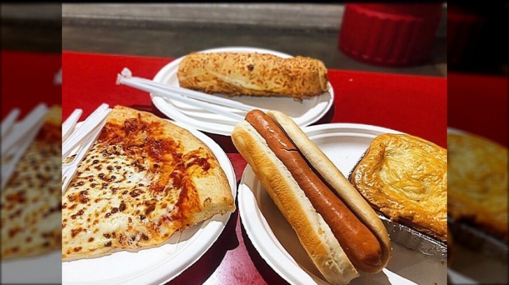 Woman eating hot dog at Costco food court