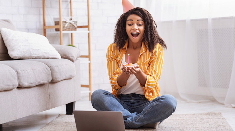 woman celebrating virtual birthday party