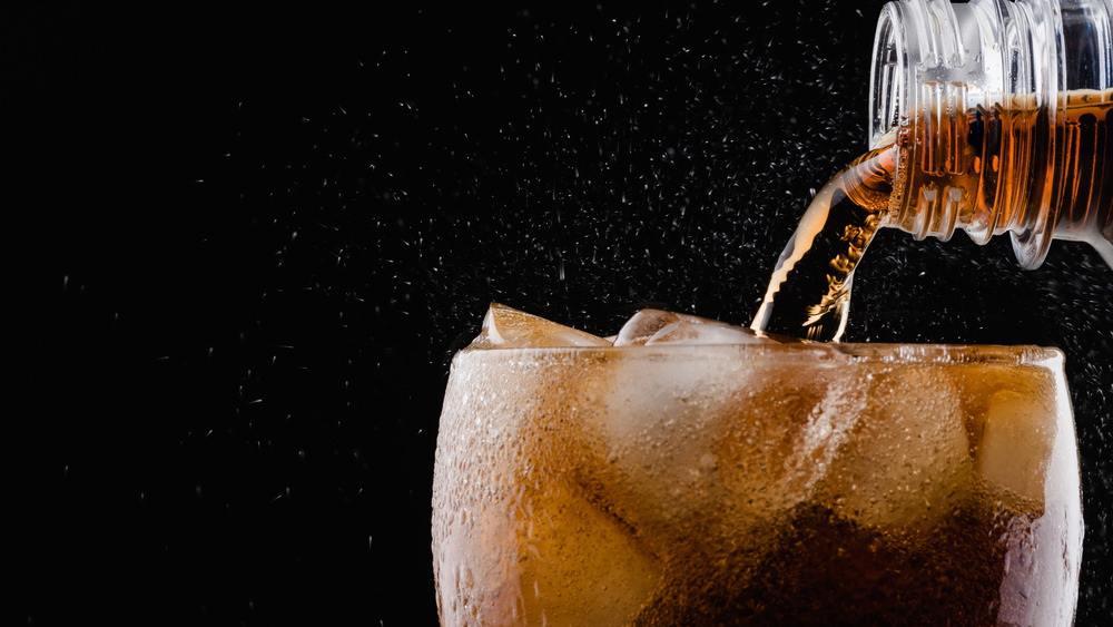 Soda being poured into a glass