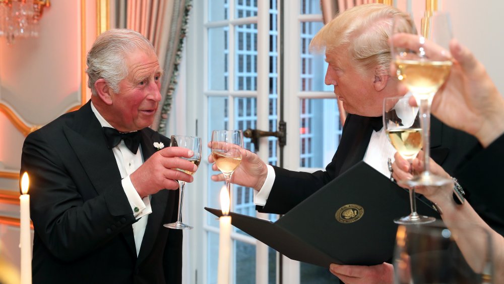 Donald Trump and Prince Charles with wine glasses