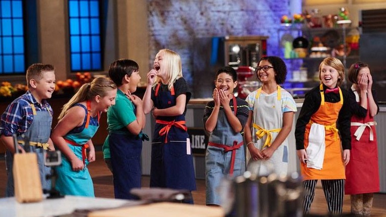 Still from "Kids Baking Championship" with row of kids