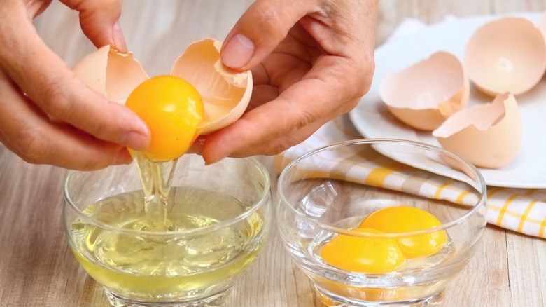 Person cracking egg