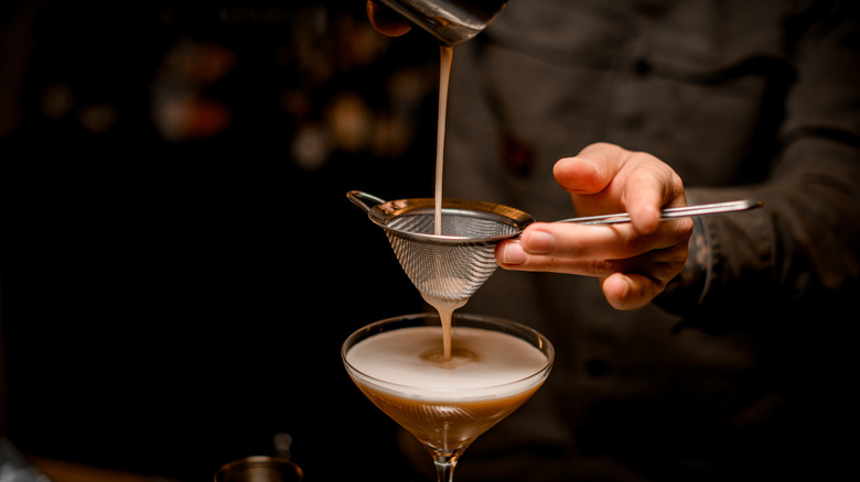 bartender pours an espresso martini