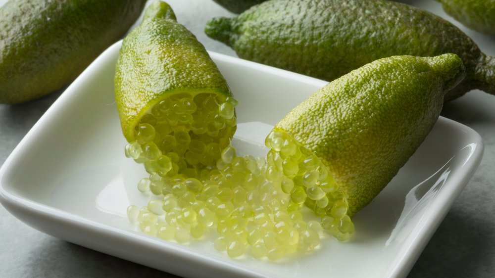 Finger limes cut in half with little pearls squeezed out