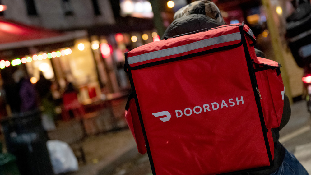 DoorDash delivery rider with backpack