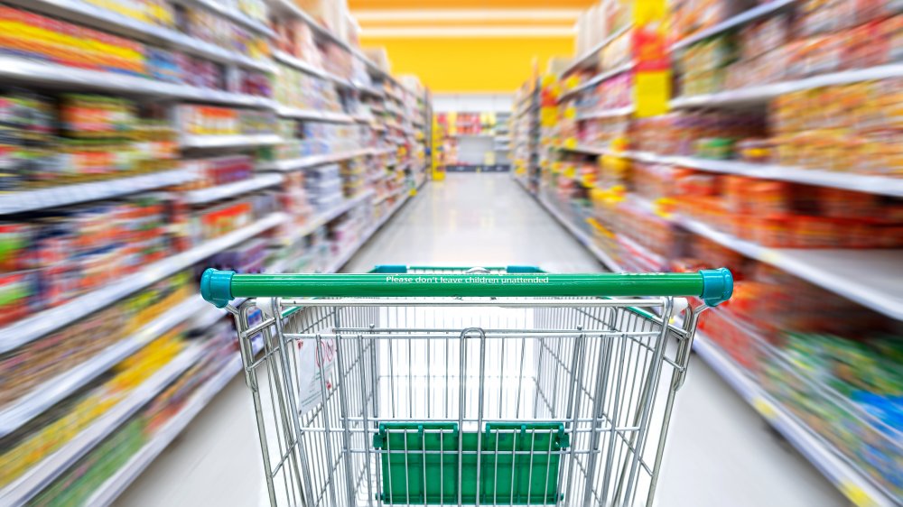 Shopping cart in grocery aisle