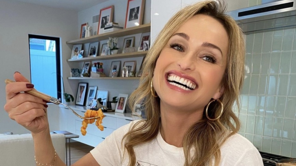 Giada de Laurentiis happily eating