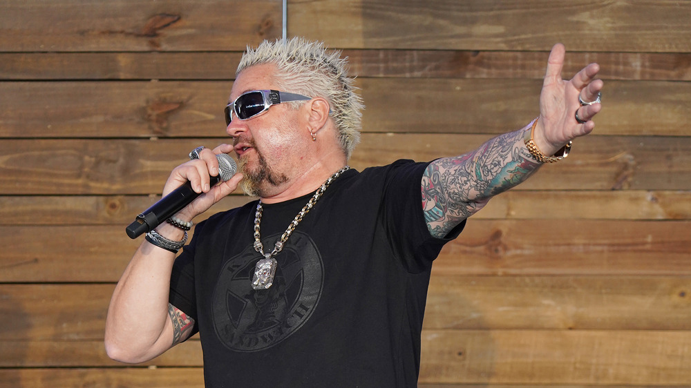 Guy Fieri talking into microphone