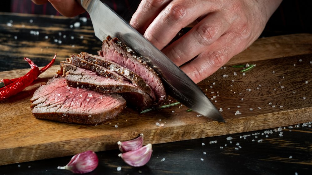 Slicing into a steak