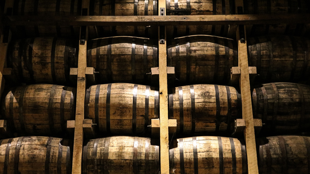 Barrels of whiskey on shelves