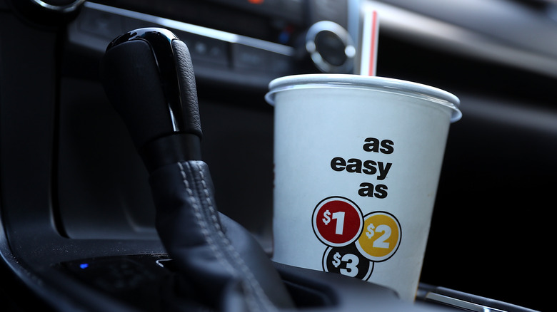 McDonald's cup in a car