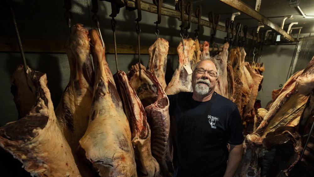 Butcher at meat processing plant