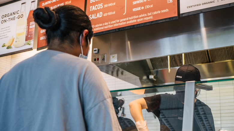 A person ordering at Chipotle