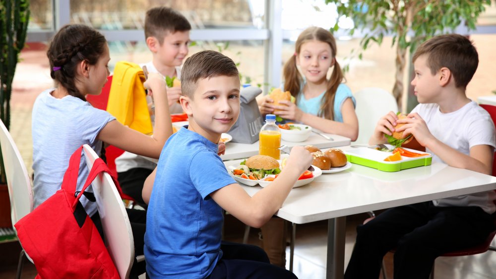 Elementary school cafeteria of children eating