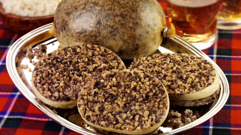 sliced and whole haggis on plate