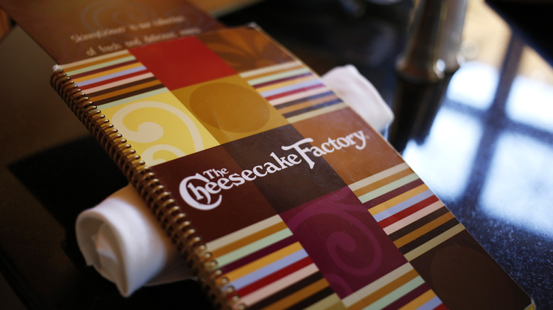 Cheesecake Factory menu resting on table