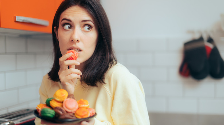 Woman eating cookies 